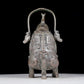 A precious bronze figure carrying a kettle