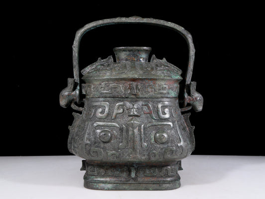 A precious bronze animal-faced pot