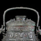 A precious bronze animal-faced pot