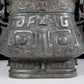 A precious bronze animal-faced pot