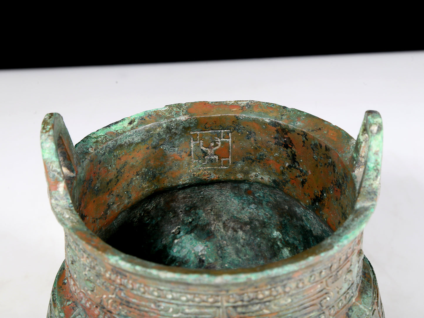 A precious bronze animal-faced two-eared and tripod furnace