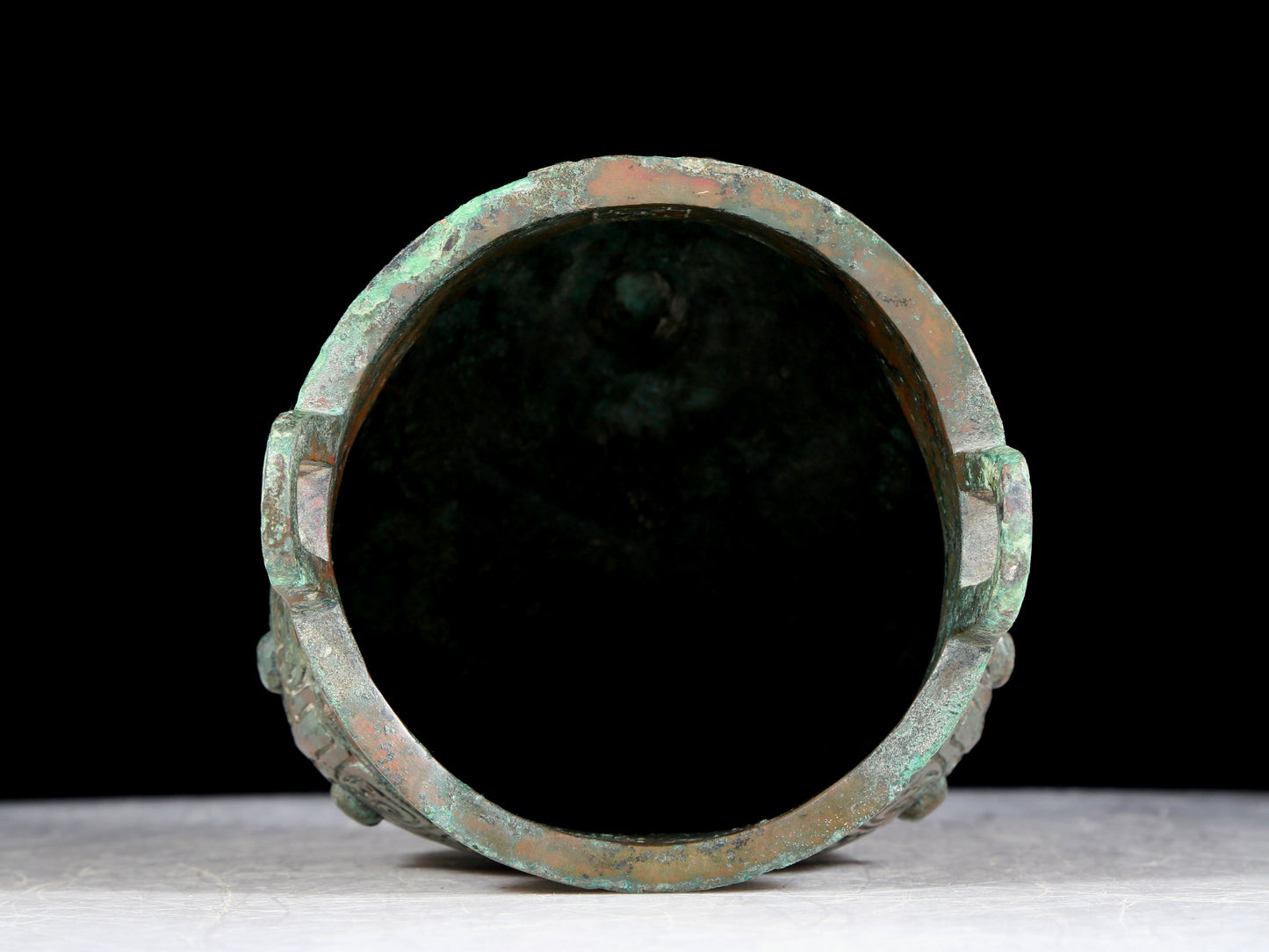 A precious bronze animal-faced two-eared and tripod furnace