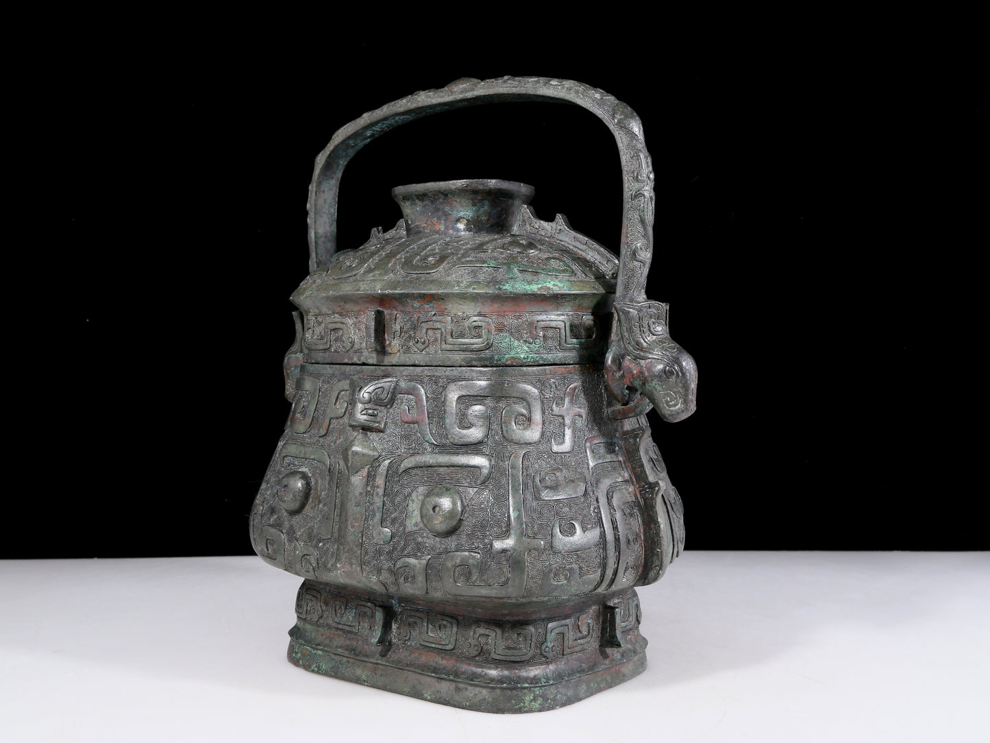 A precious bronze animal-faced pot