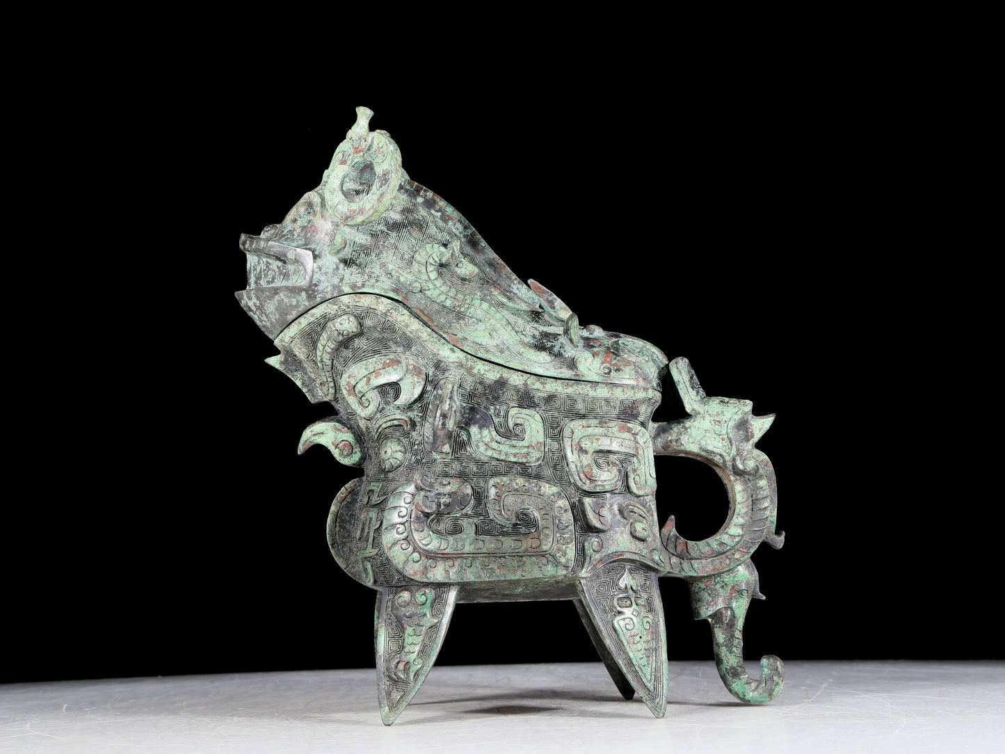 A precious bronze auspicious animal holding pot