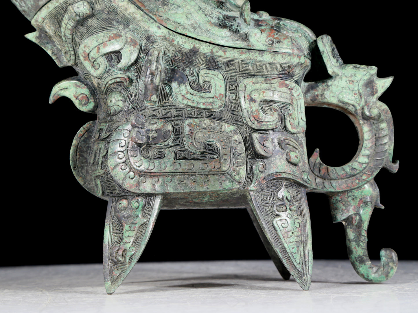 A precious bronze auspicious animal holding pot