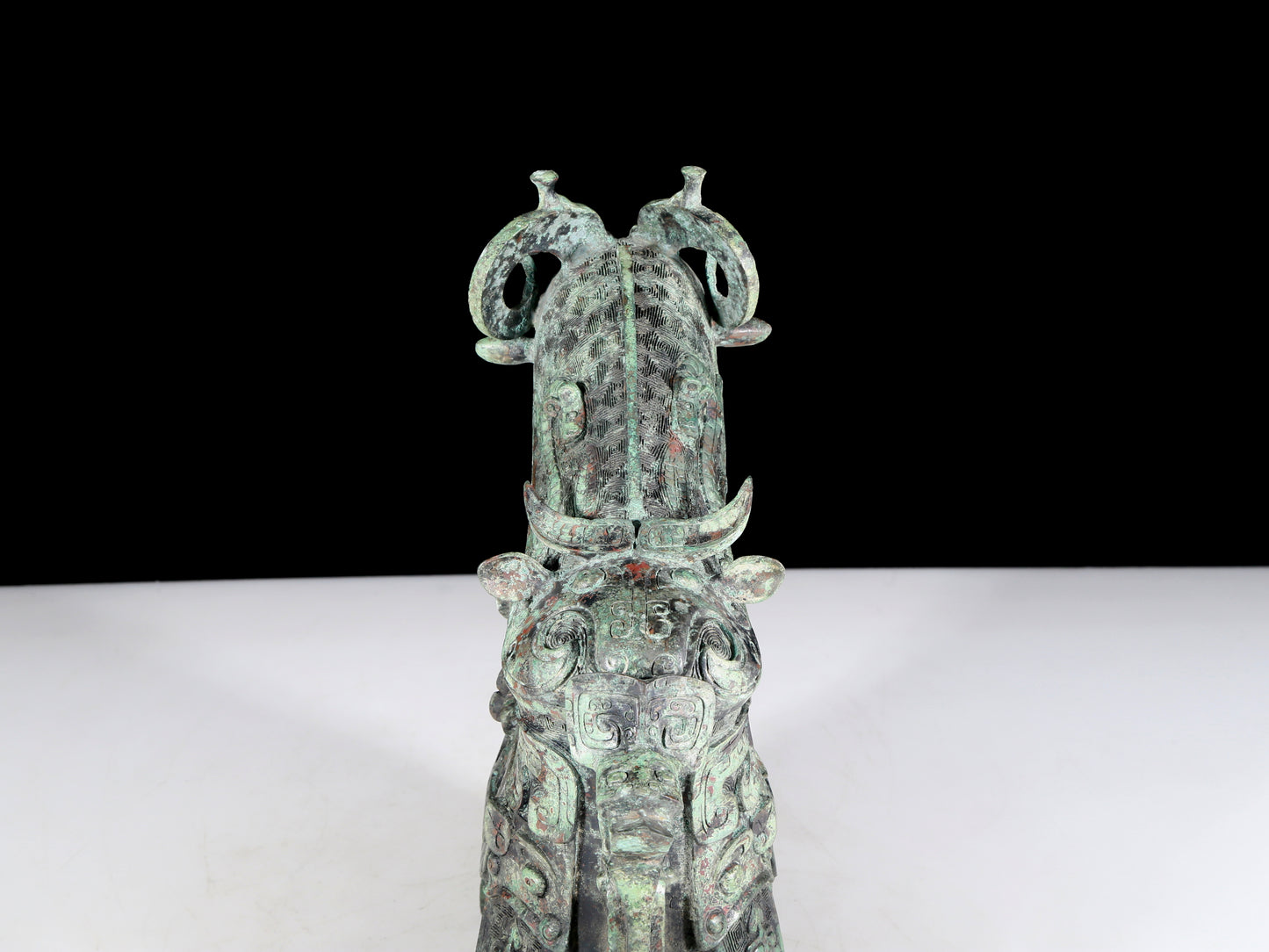 A precious bronze auspicious animal holding pot