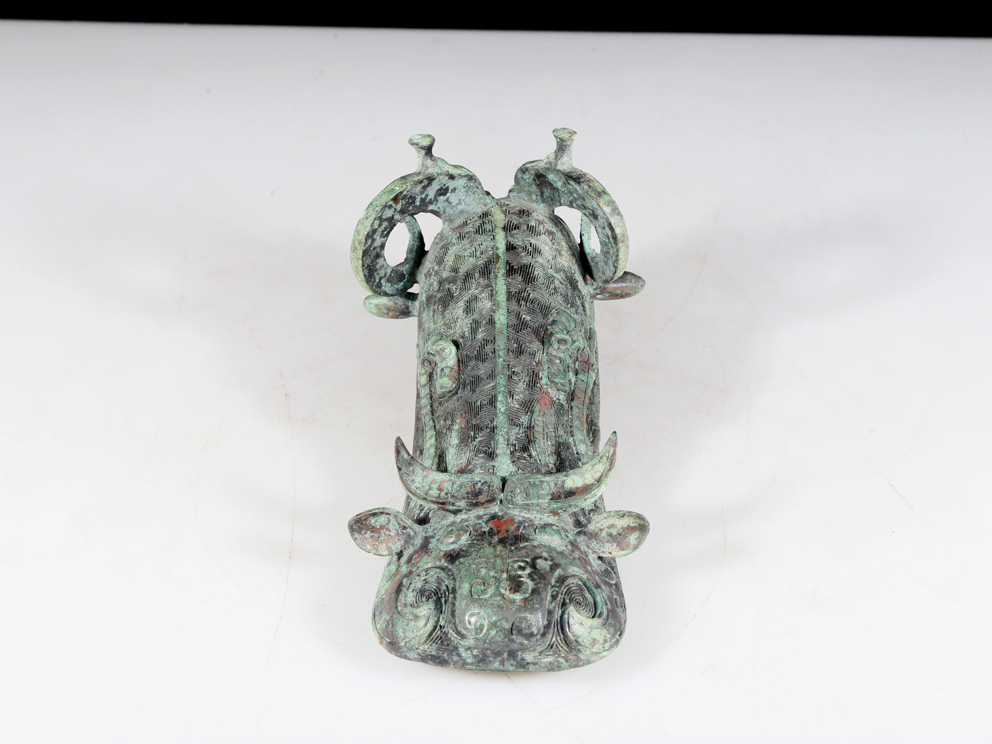 A precious bronze auspicious animal holding pot