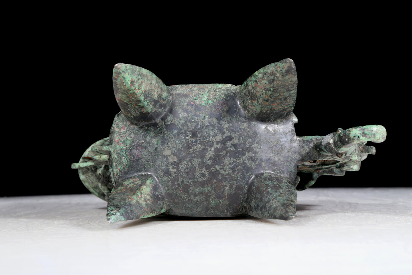 A precious bronze auspicious animal holding pot