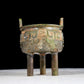 A precious bronze animal-faced two-eared and tripod furnace