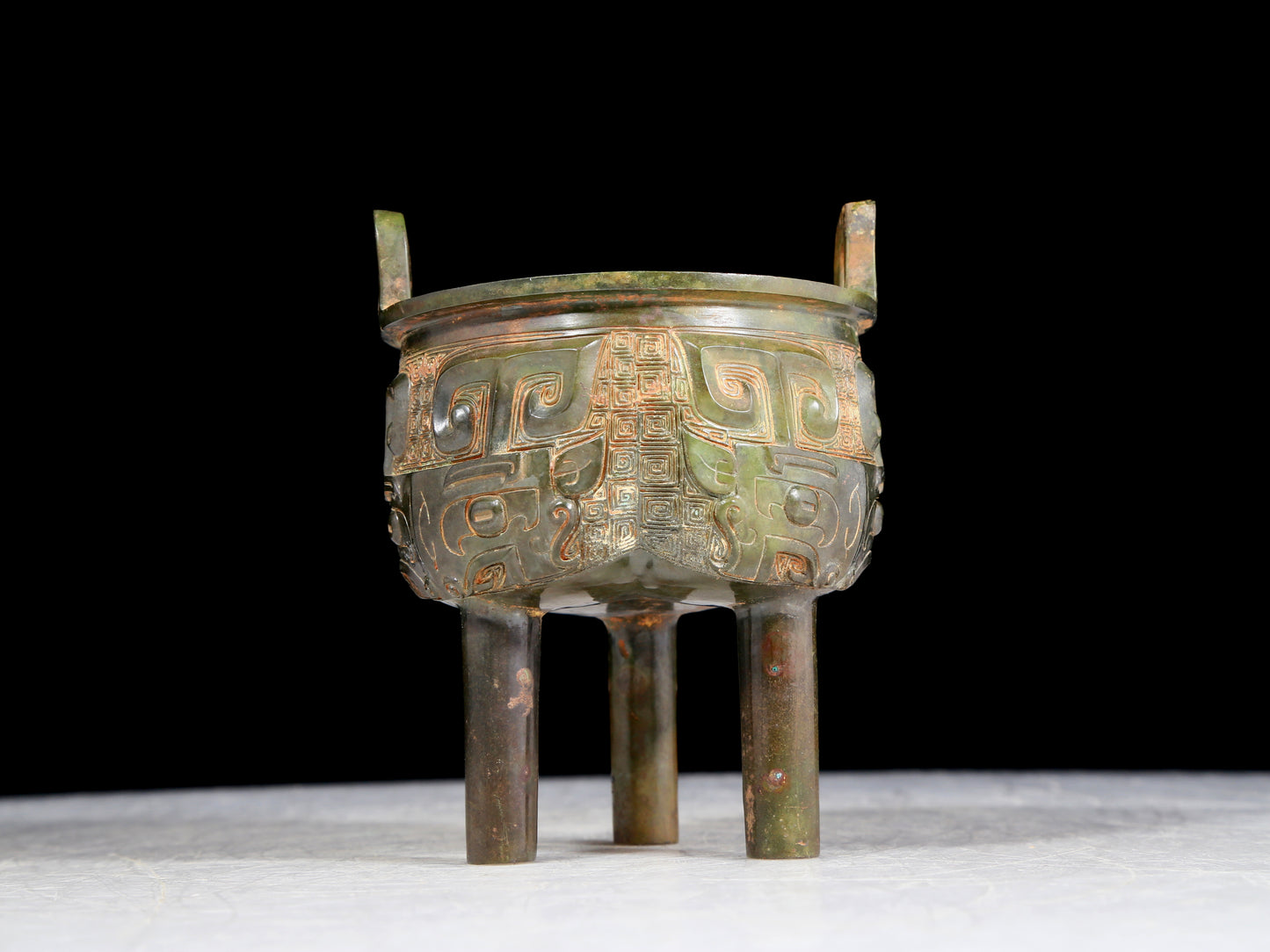 A precious bronze animal-faced two-eared and tripod furnace