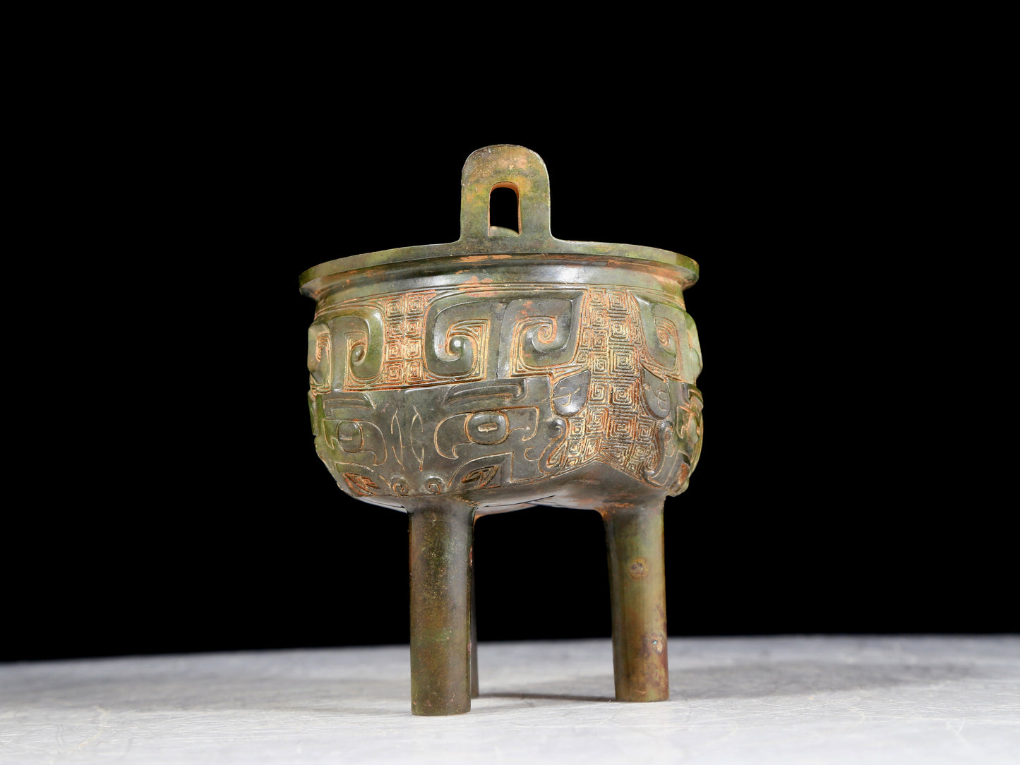 A precious bronze animal-faced two-eared and tripod furnace