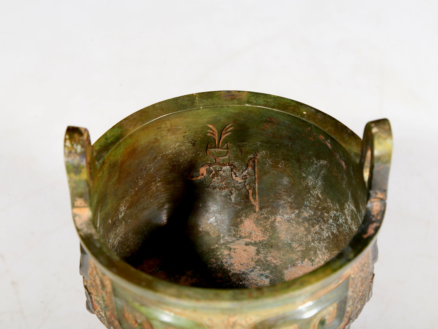 A precious bronze animal-faced two-eared and tripod furnace