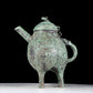 A precious bronze tripod ewer with animal masks