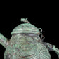 A precious bronze tripod ewer with animal masks