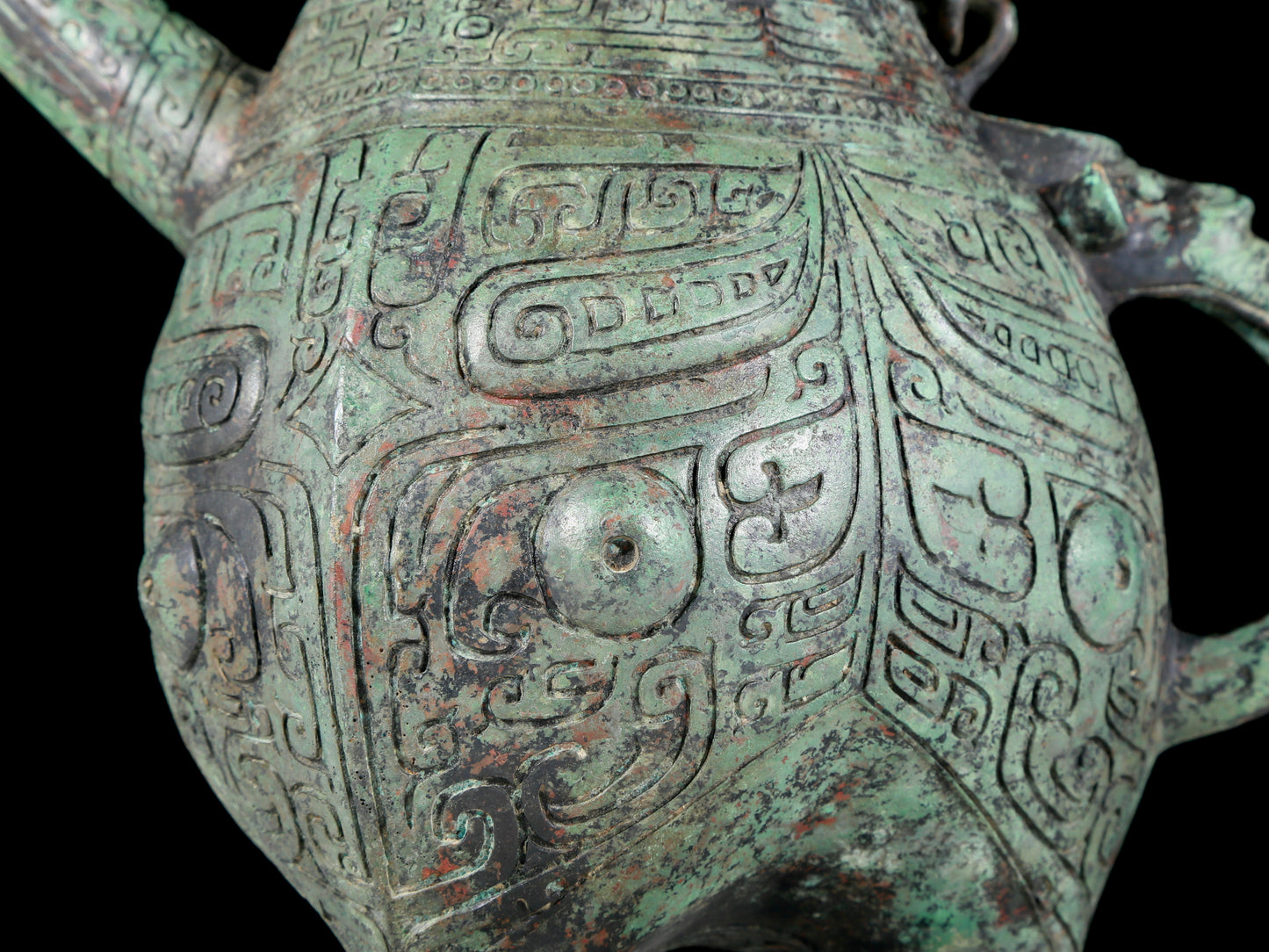 A precious bronze tripod ewer with animal masks