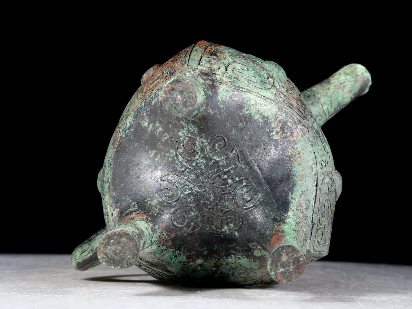 A precious bronze tripod ewer with animal masks