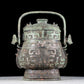 A precious bronze animal-faced pot