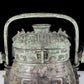 A precious bronze animal-faced pot