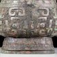 A precious bronze animal-faced pot