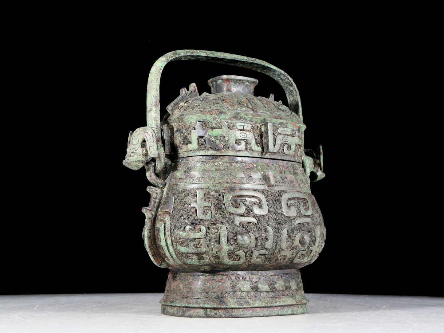 A precious bronze animal-faced pot