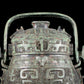 A precious bronze animal-faced pot