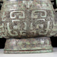 A precious bronze animal-faced pot