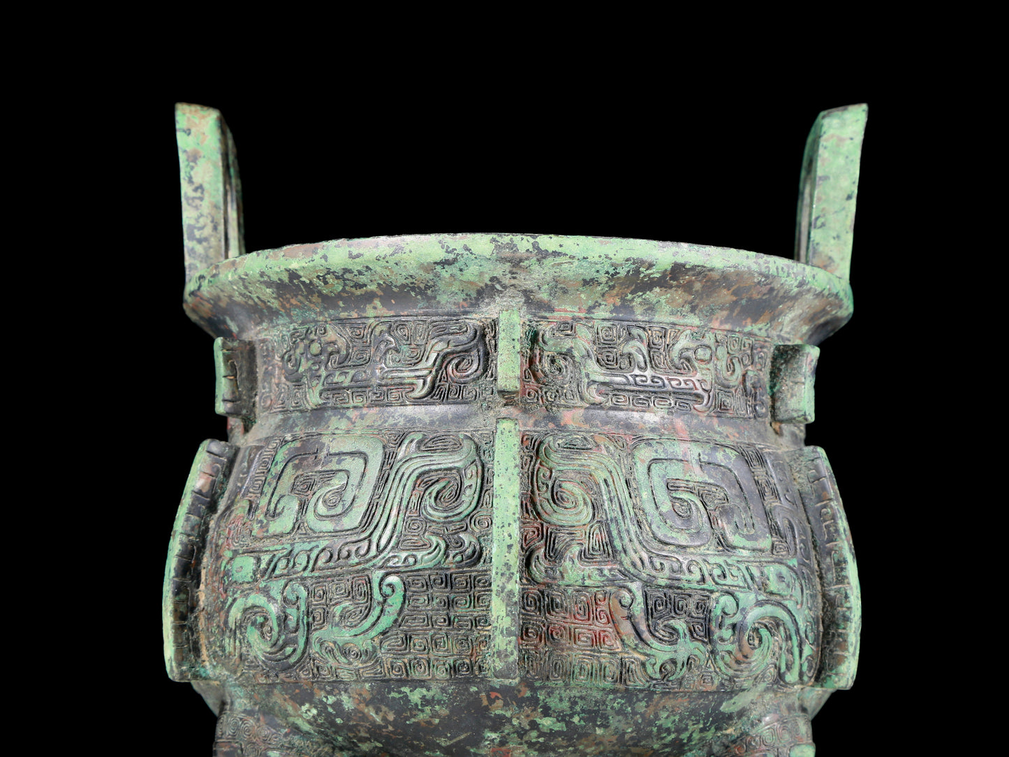 A precious bronze animal-faced two-eared and tripod furnace