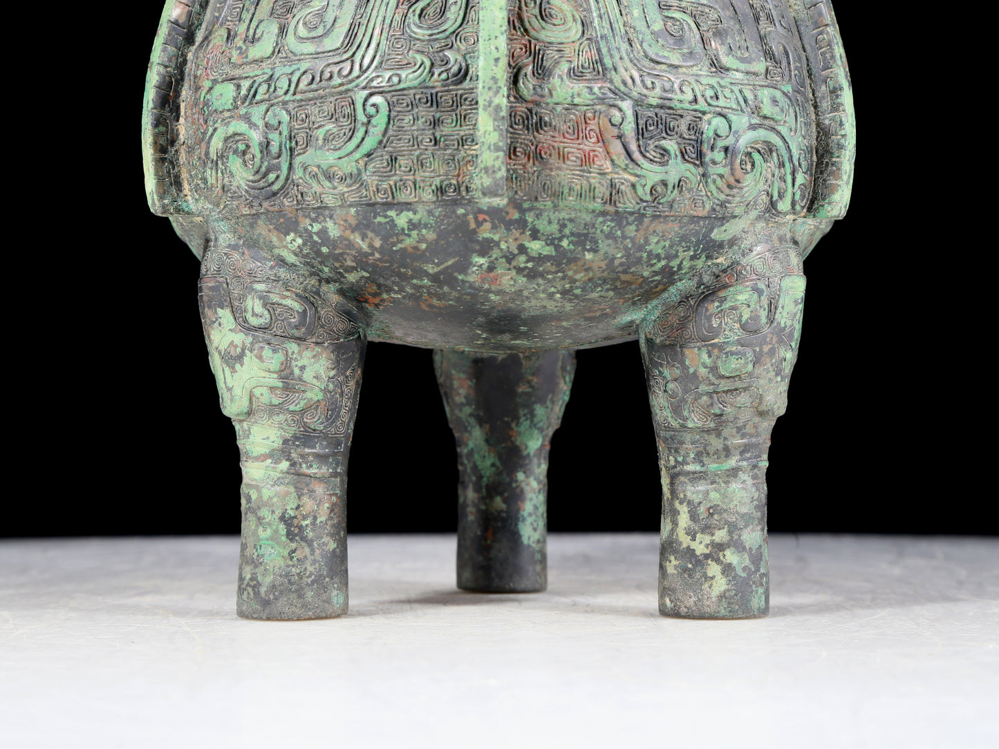 A precious bronze animal-faced two-eared and tripod furnace