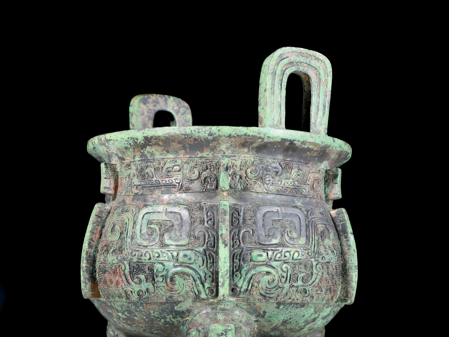 A precious bronze animal-faced two-eared and tripod furnace