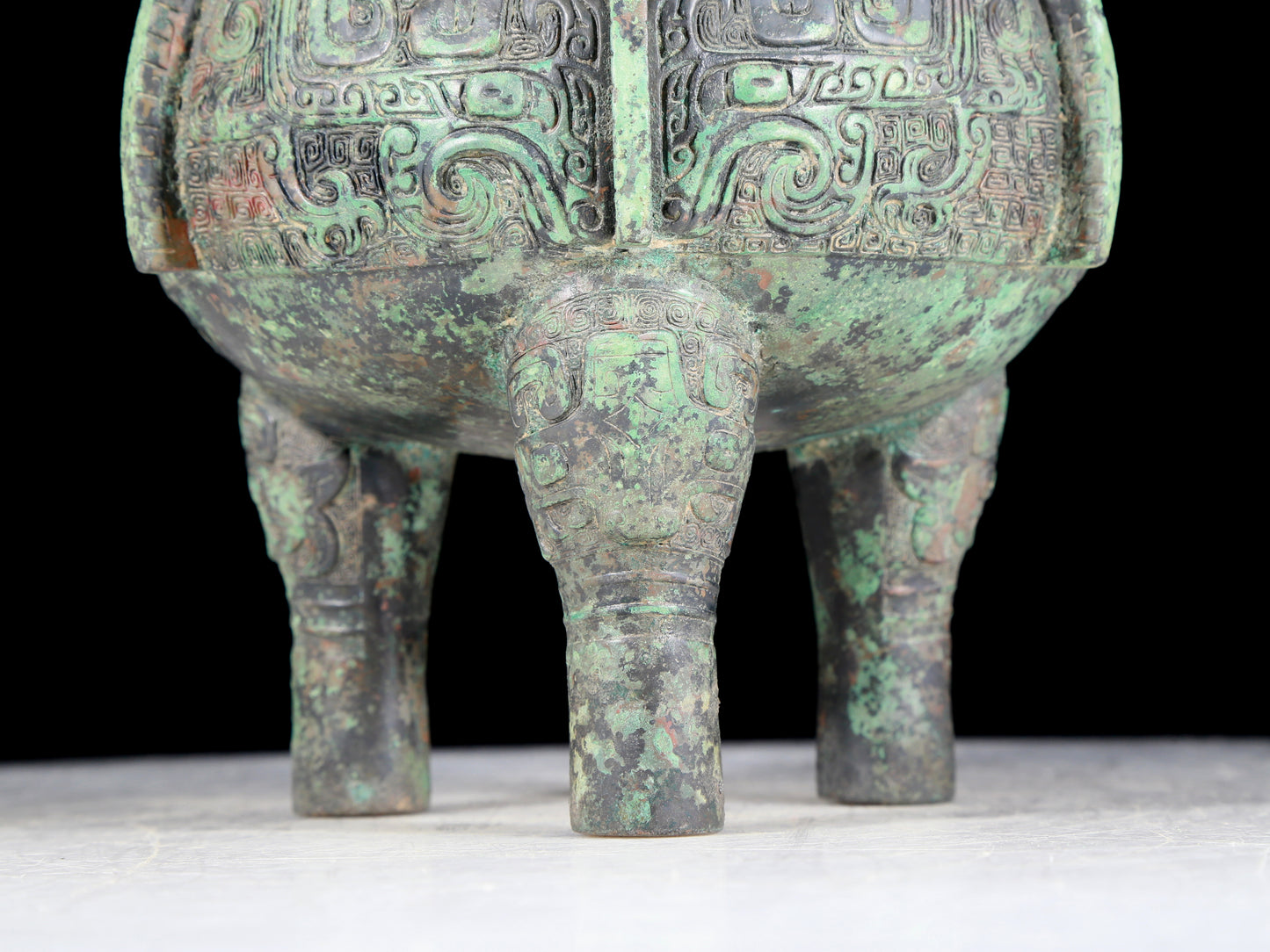 A precious bronze animal-faced two-eared and tripod furnace