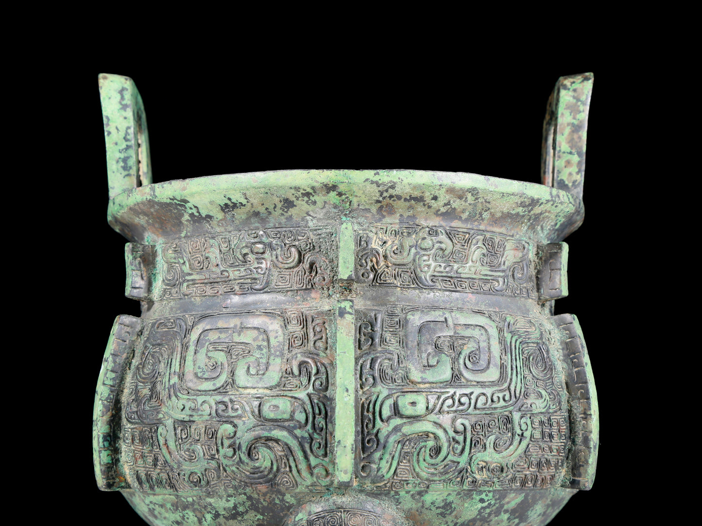 A precious bronze animal-faced two-eared and tripod furnace