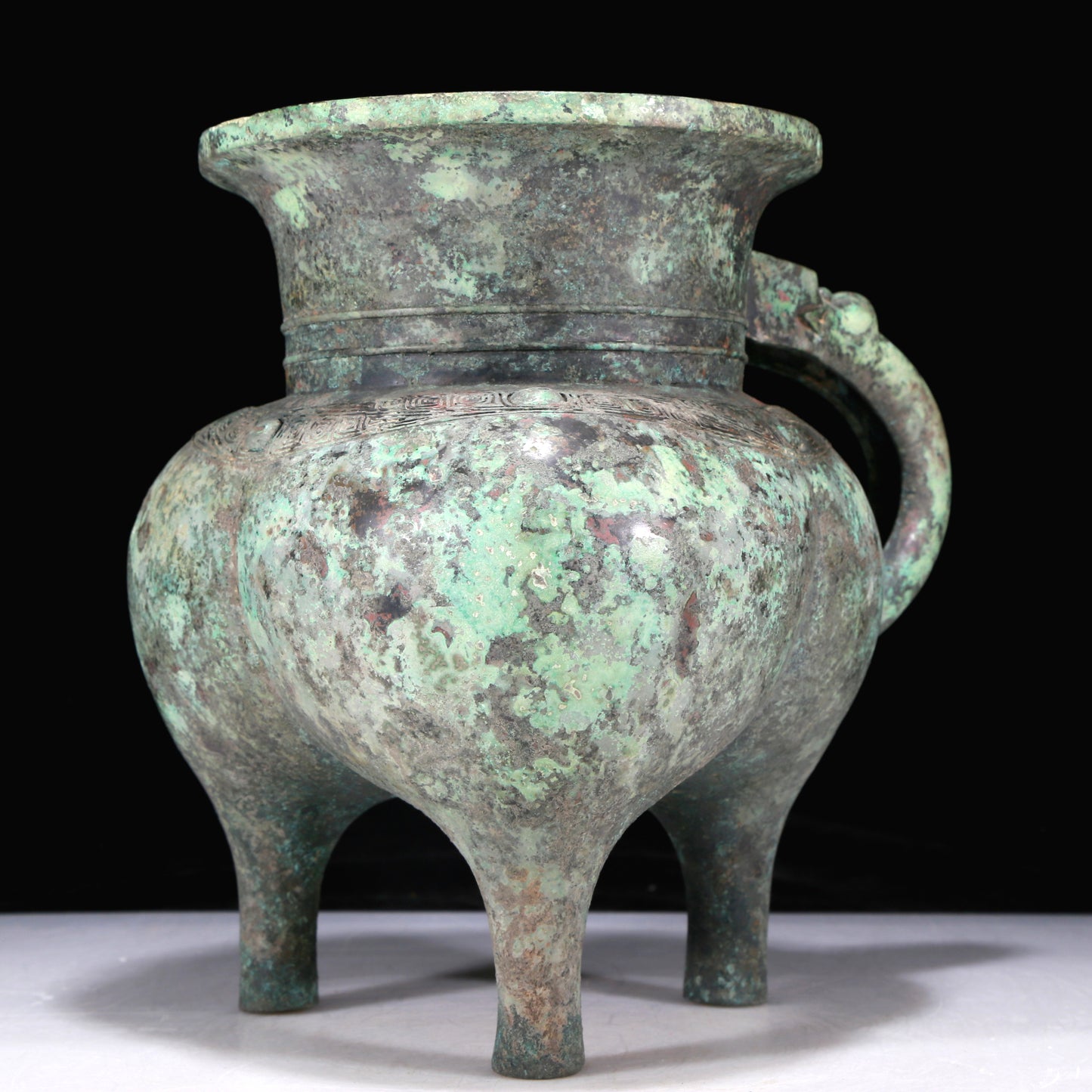 A Precious Bronze 'Dragon' Tripod Ewer