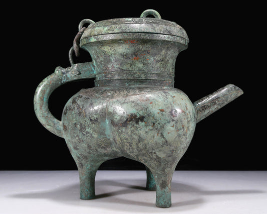 An Excellent Bronze 'Auspicious Beast' Tripod Ewer