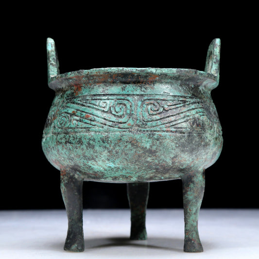 An Archaic Bronze 'Auspicious Cloud' Tripod Censer