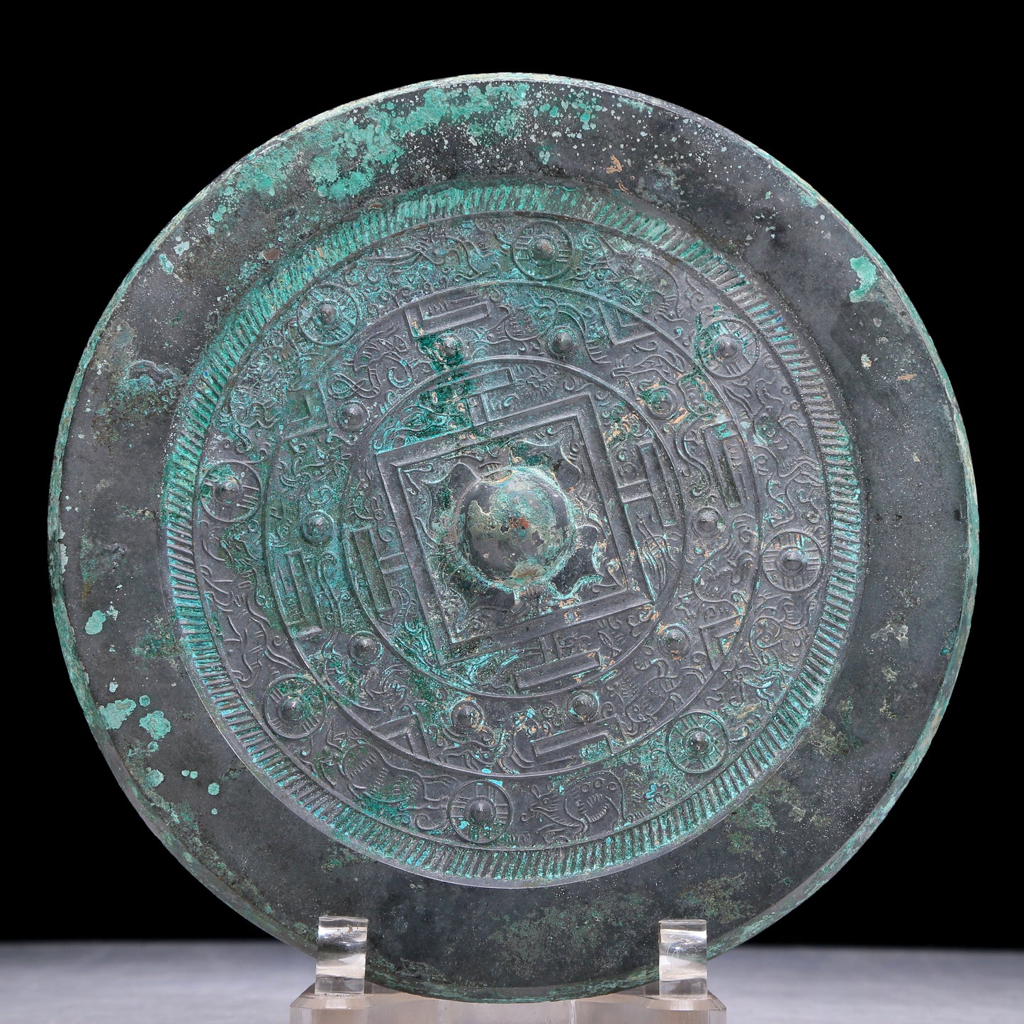 An Archaic Circular Bronze 'Auspicious Beast' Mirror