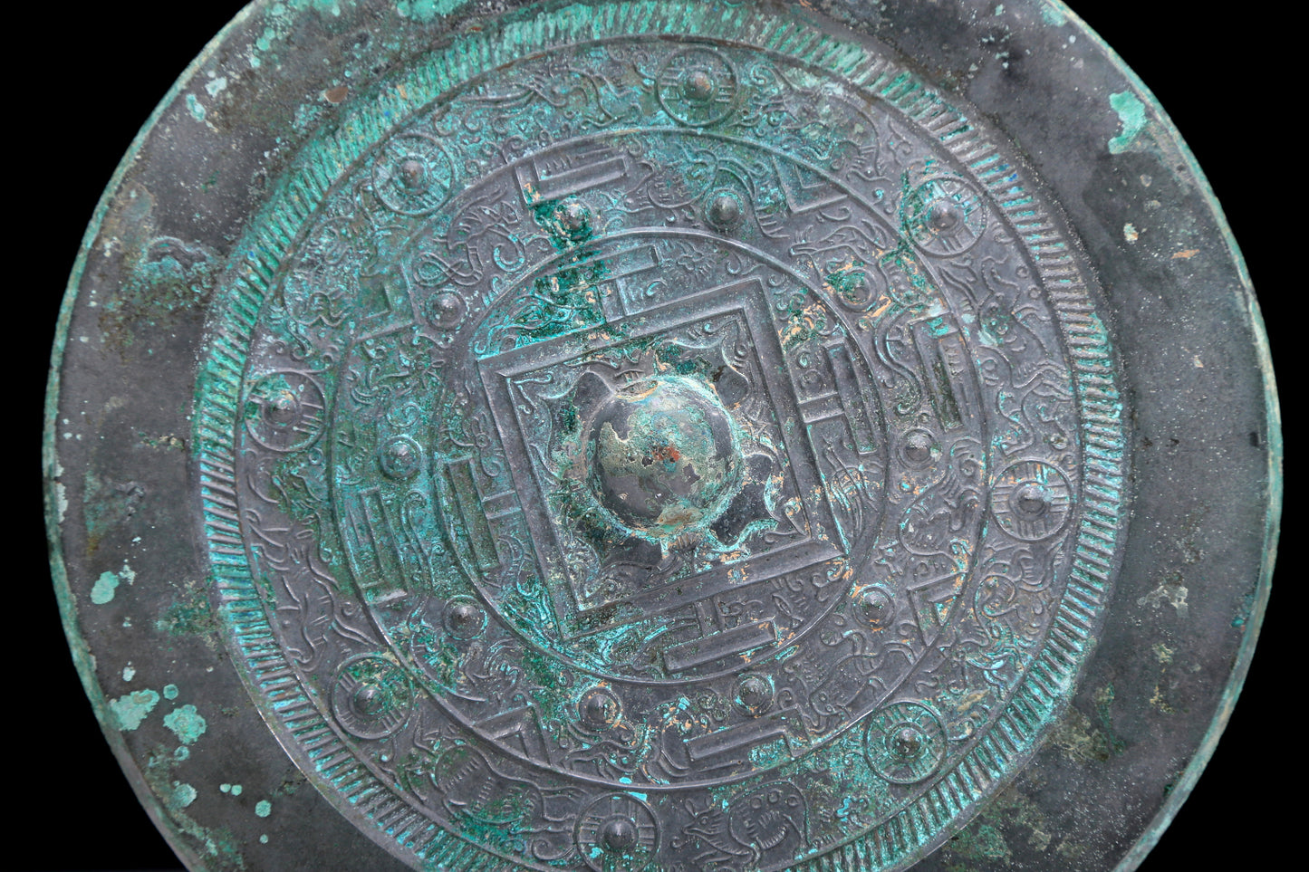 An Archaic Circular Bronze 'Auspicious Beast' Mirror