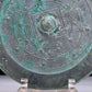 An Archaic Circular Bronze 'Auspicious Beast' Mirror