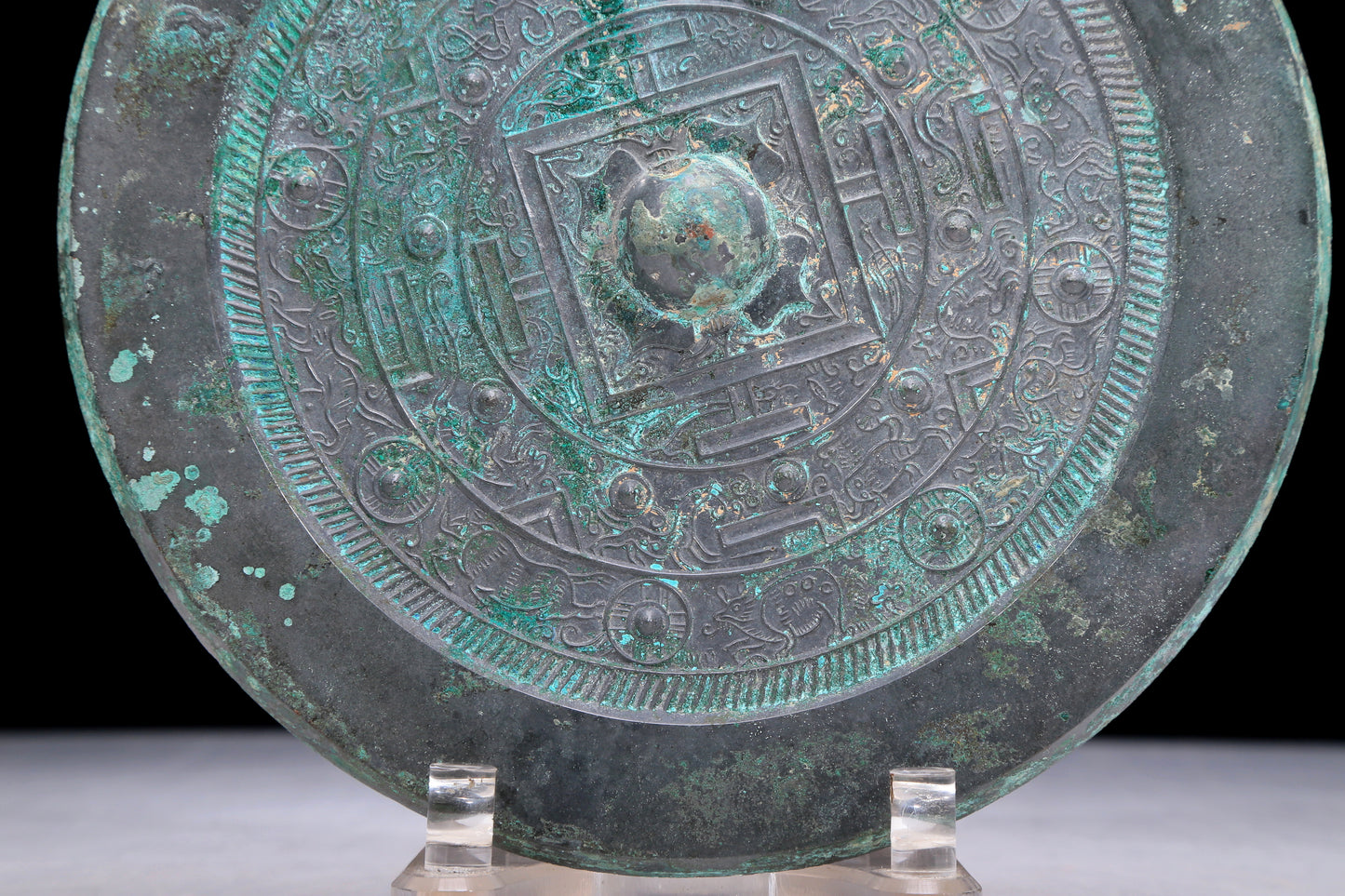 An Archaic Circular Bronze 'Auspicious Beast' Mirror