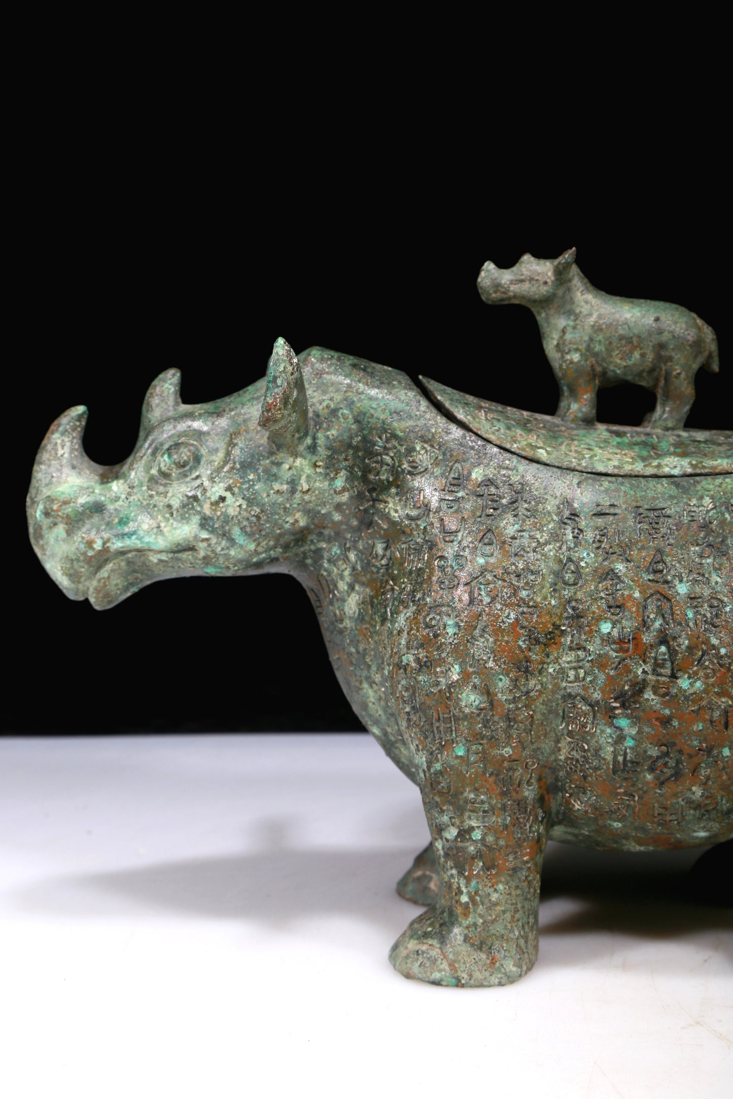 A Fantastic Bronze Rhinoceros-Form Jar With Inscriptions