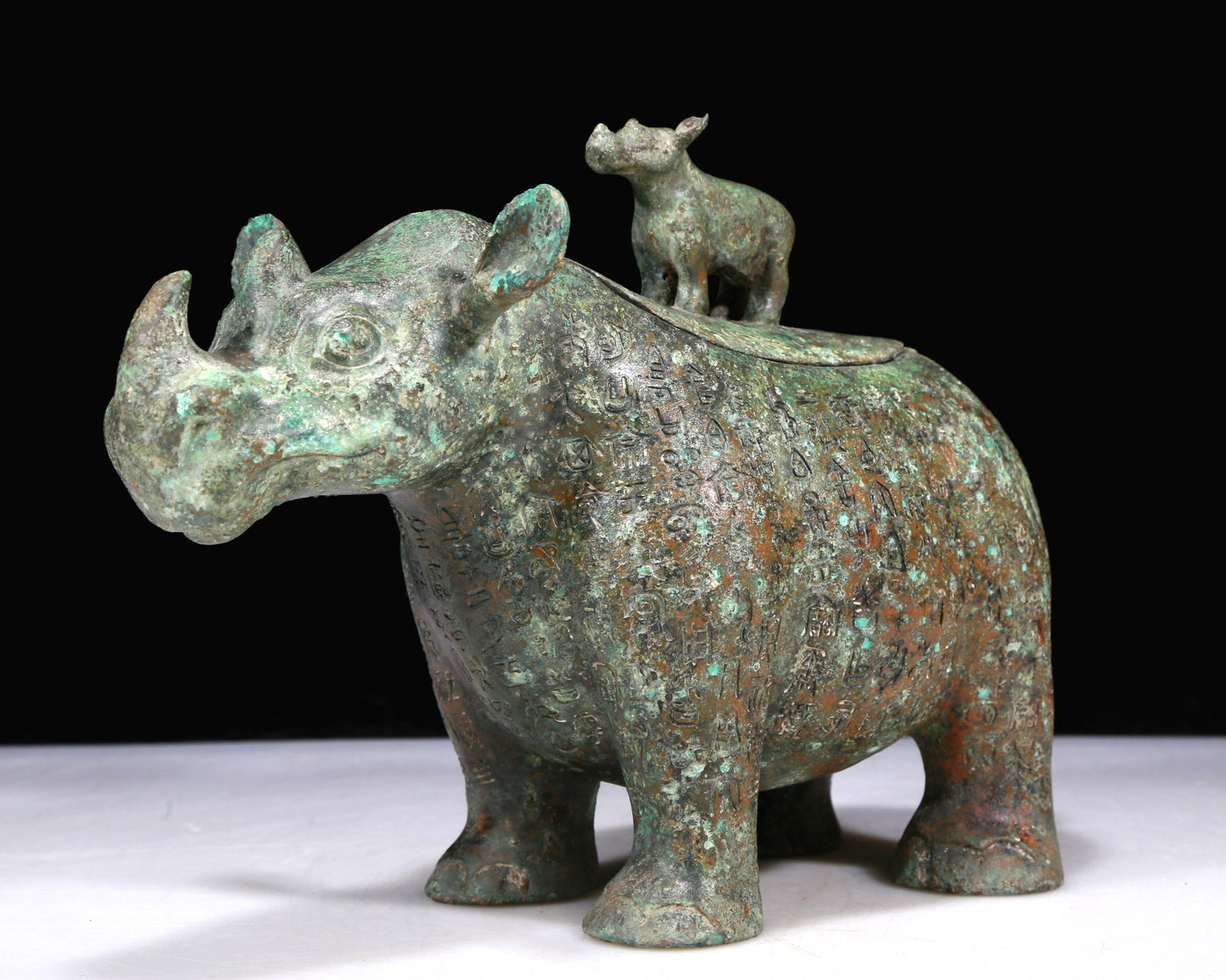 A Fantastic Bronze Rhinoceros-Form Jar With Inscriptions