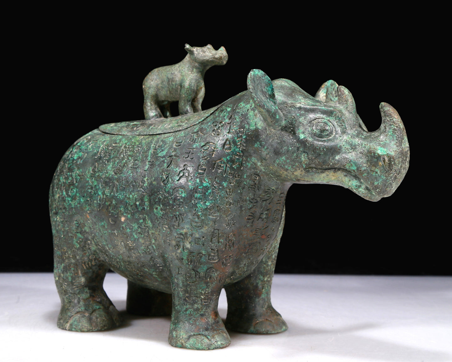 A Fantastic Bronze Rhinoceros-Form Jar With Inscriptions