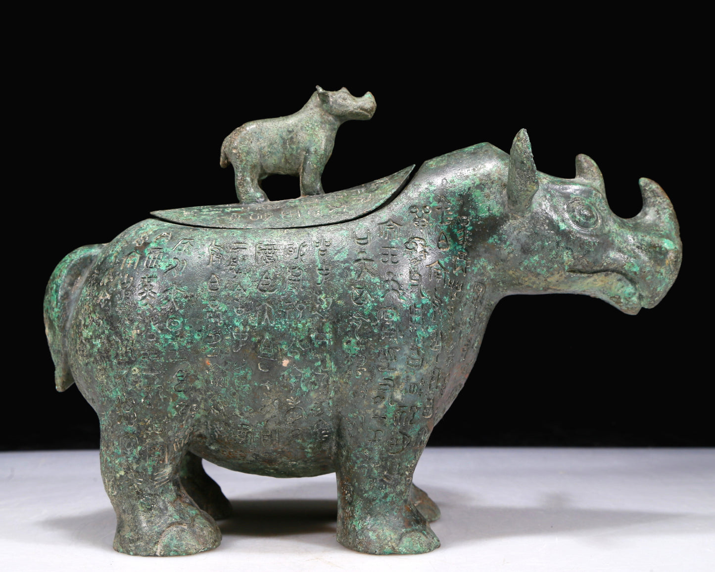 A Fantastic Bronze Rhinoceros-Form Jar With Inscriptions