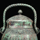 A Fantastic Bronze 'Animal Mask' Jar With Inscriptions And An Overhead Handle