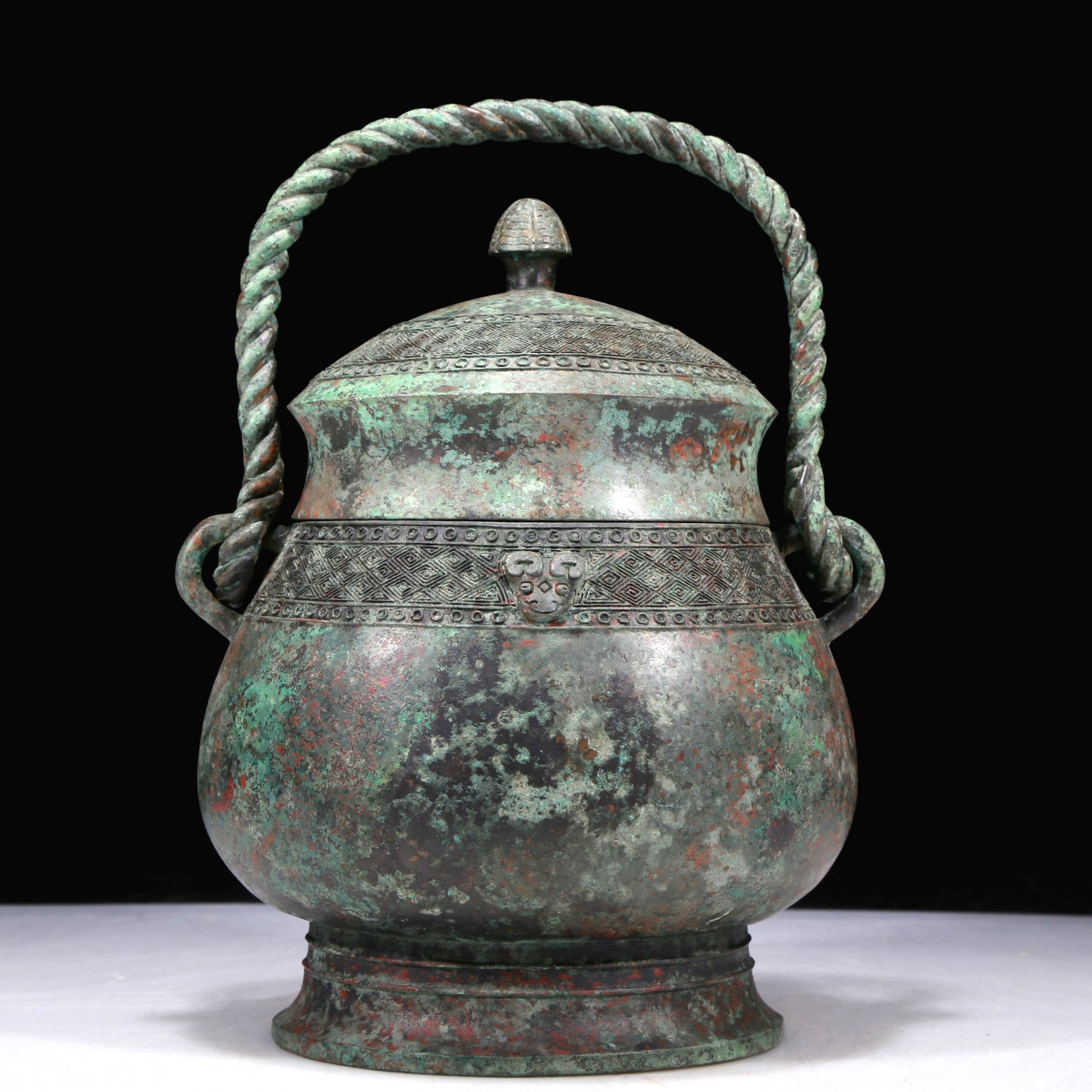 A Fantastic Bronze 'Animal Mask' Jar With Inscriptions And An Overhead Handle