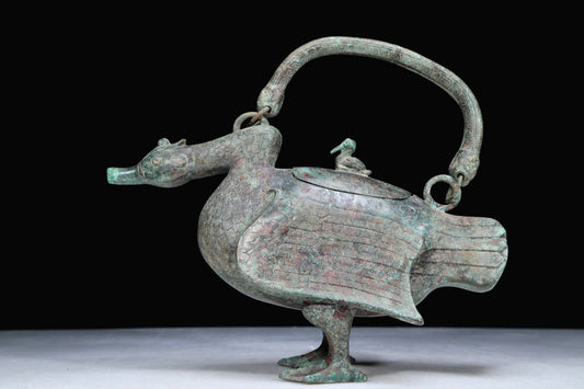 An Archaic Bronze Duck-Form Pot With Inscriptions And An Overhead Handle