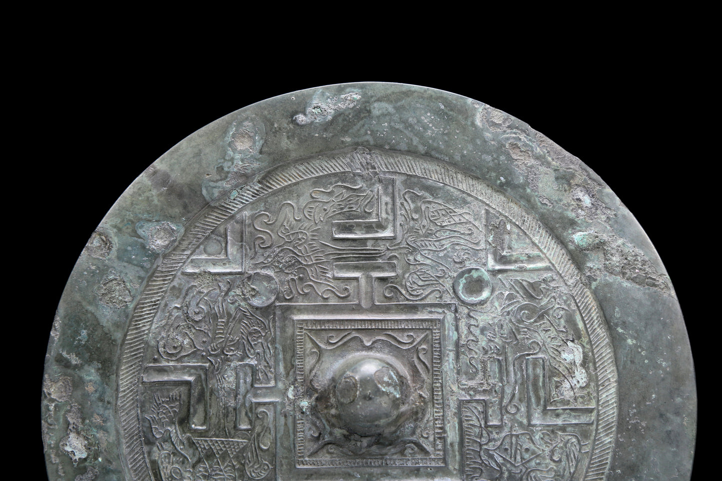 An Archaic Circular Bronze 'Auspicious Beast' Mirror