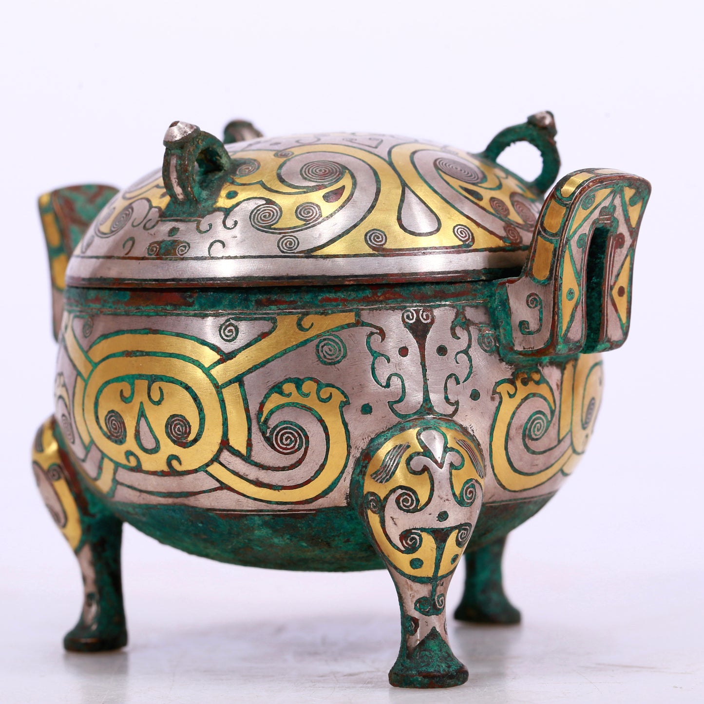 An Archaic Bronze Silver-Inlaid 'Flower' Tripod Censer And Cover