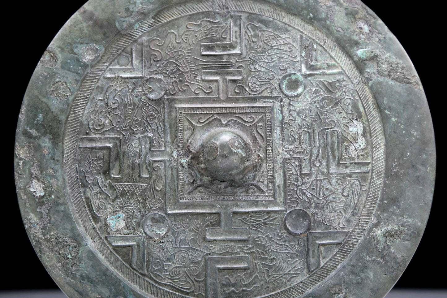 An Archaic Circular Bronze 'Auspicious Beast' Mirror