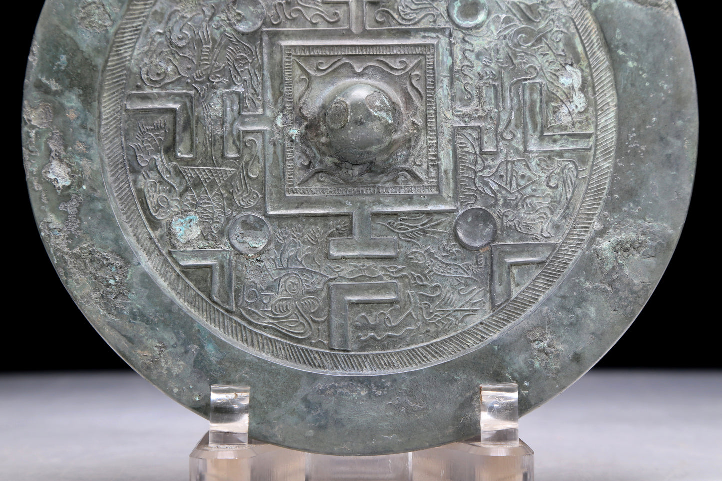 An Archaic Circular Bronze 'Auspicious Beast' Mirror