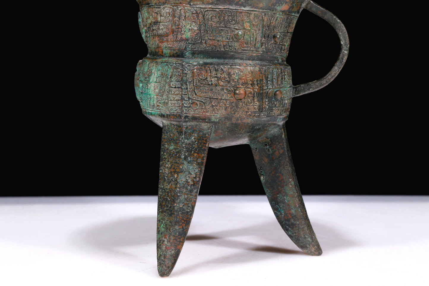 A Marvelous Bronze 'Animal Mask' Tripod Cup